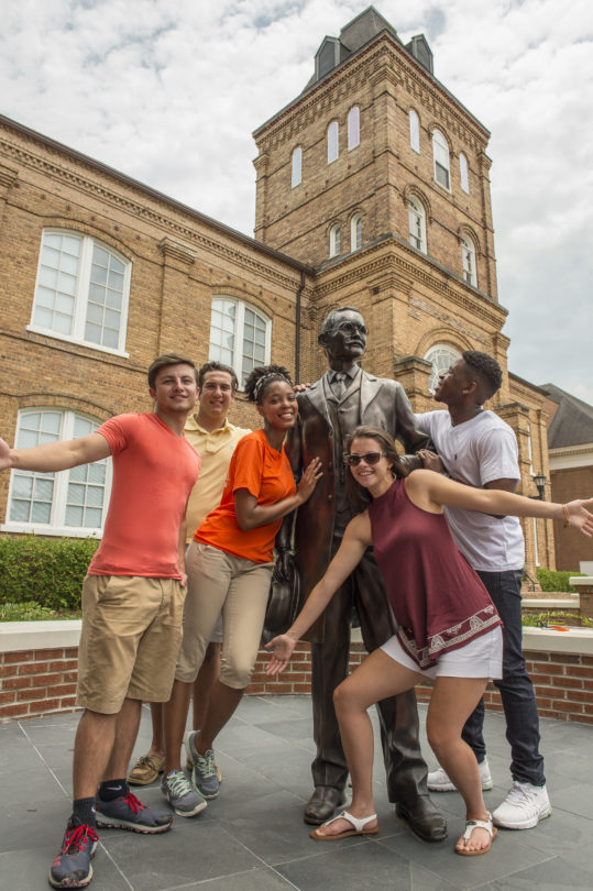 students with ja campbell statue