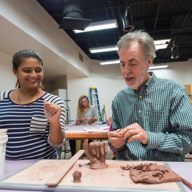 image of art students in sculpting class