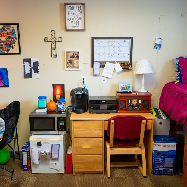 Image of a of Burkot Hall room including a desk and twin bed.