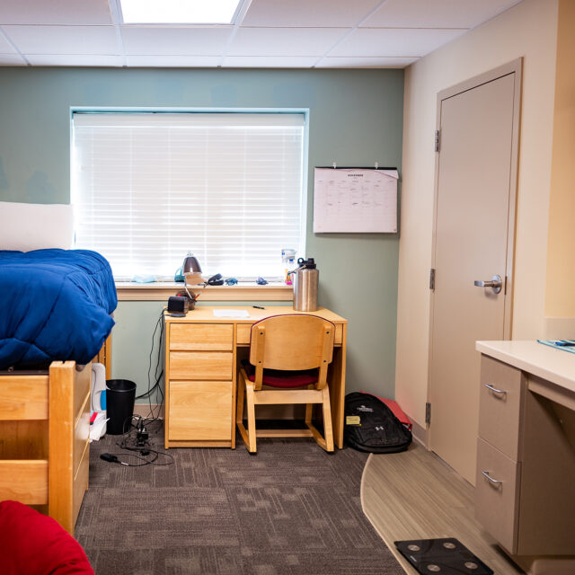 Image of a Jones Hall bedroom including a twin bed and desk