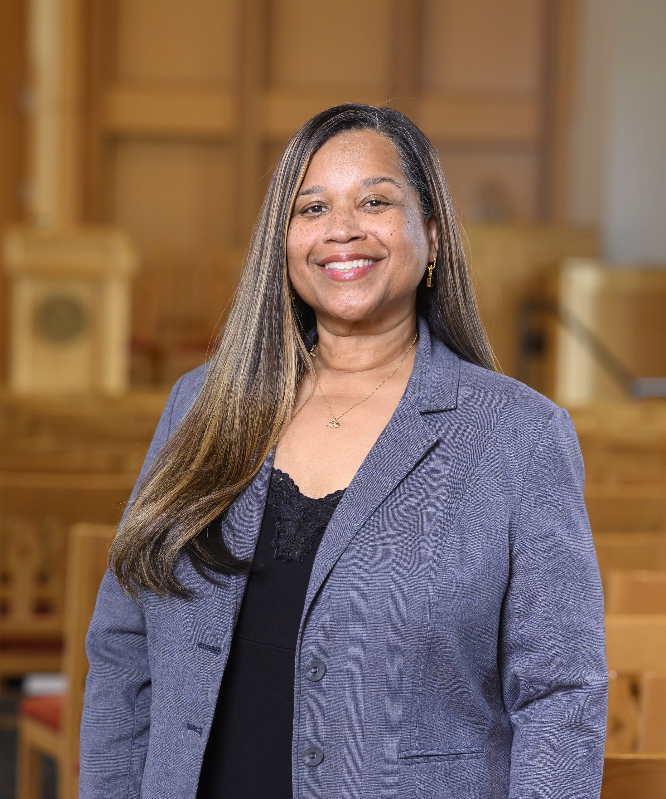 Woman in suit smiling