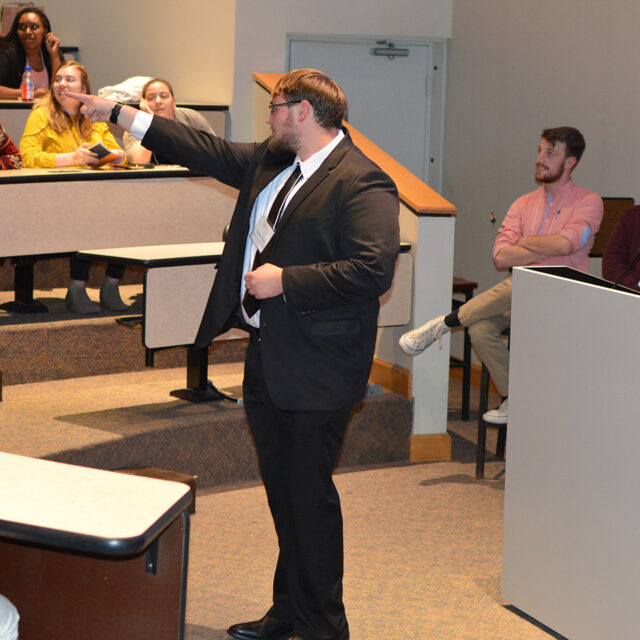 image of professor instructing students