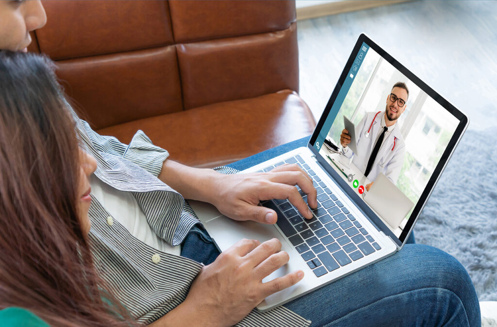 A couple participating in a telehealth appointment.