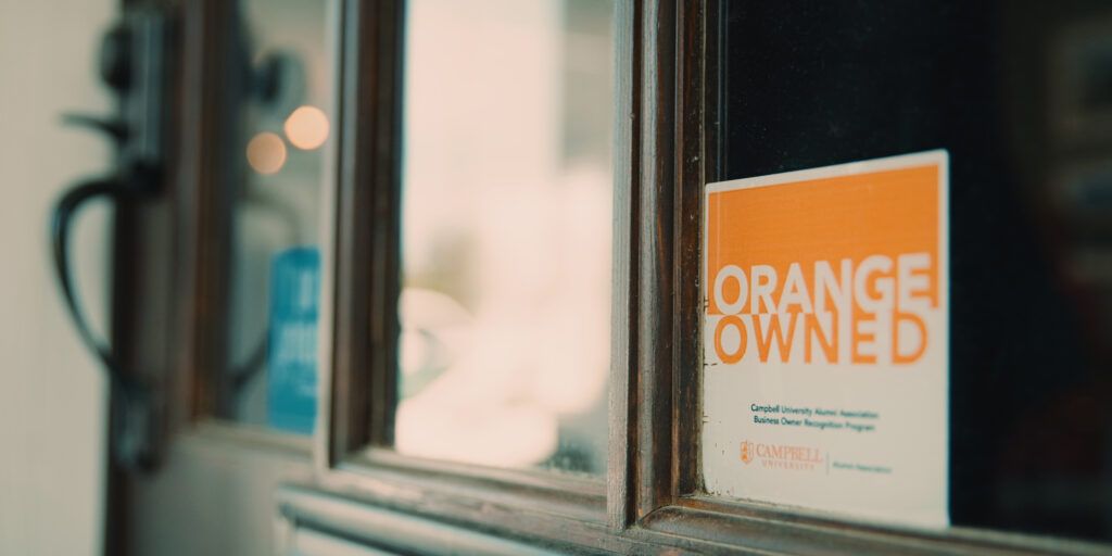 Orange Owned decal in window