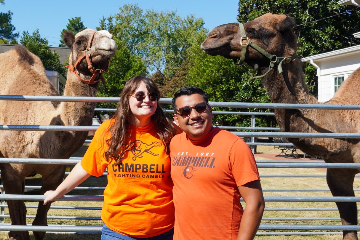 Two Campbell Alumni and Two Camels