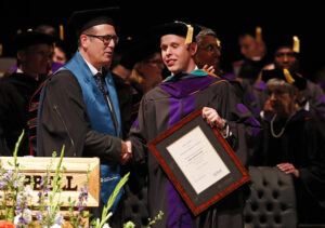 Photo of David Dittmar receiving his LLM award from Nottingham Law School's Matthew Homewood