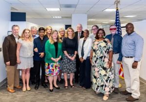 Photo of OJJDP group including Professor Jon Powell  meeting in an office in DC