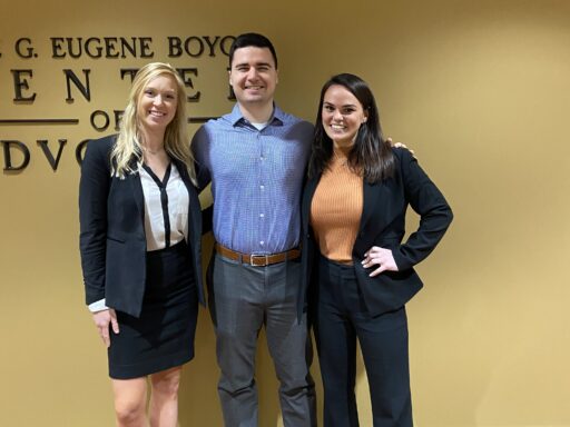 Photo of two 2020 ABA semi-finalists for Client Counseling posing with their coach Zack Anstett '18