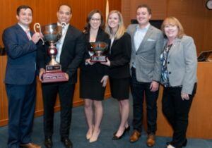 Photo of Kevin Littlejohn and other NCTC national champions posing with trophies