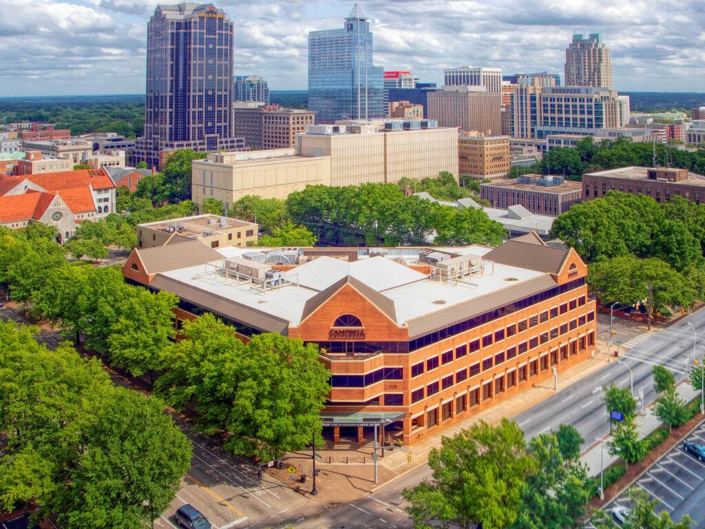 Aerial view photo of the Raleigh campus with downtown in the background