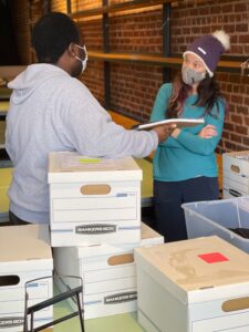 Photo of Blanchard Community Law Clinic new attorneys standing among boxes in new clinic space