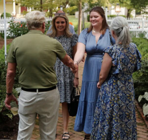 Photo of the Dean greeting students at Deans BBQ at Haywood Hall