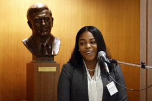 Photo of Adia McLaughlin '23 speaking at podium