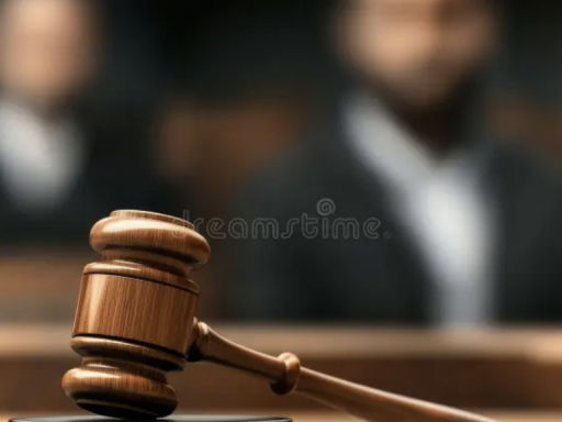 Photo of gavel with blurry people in background