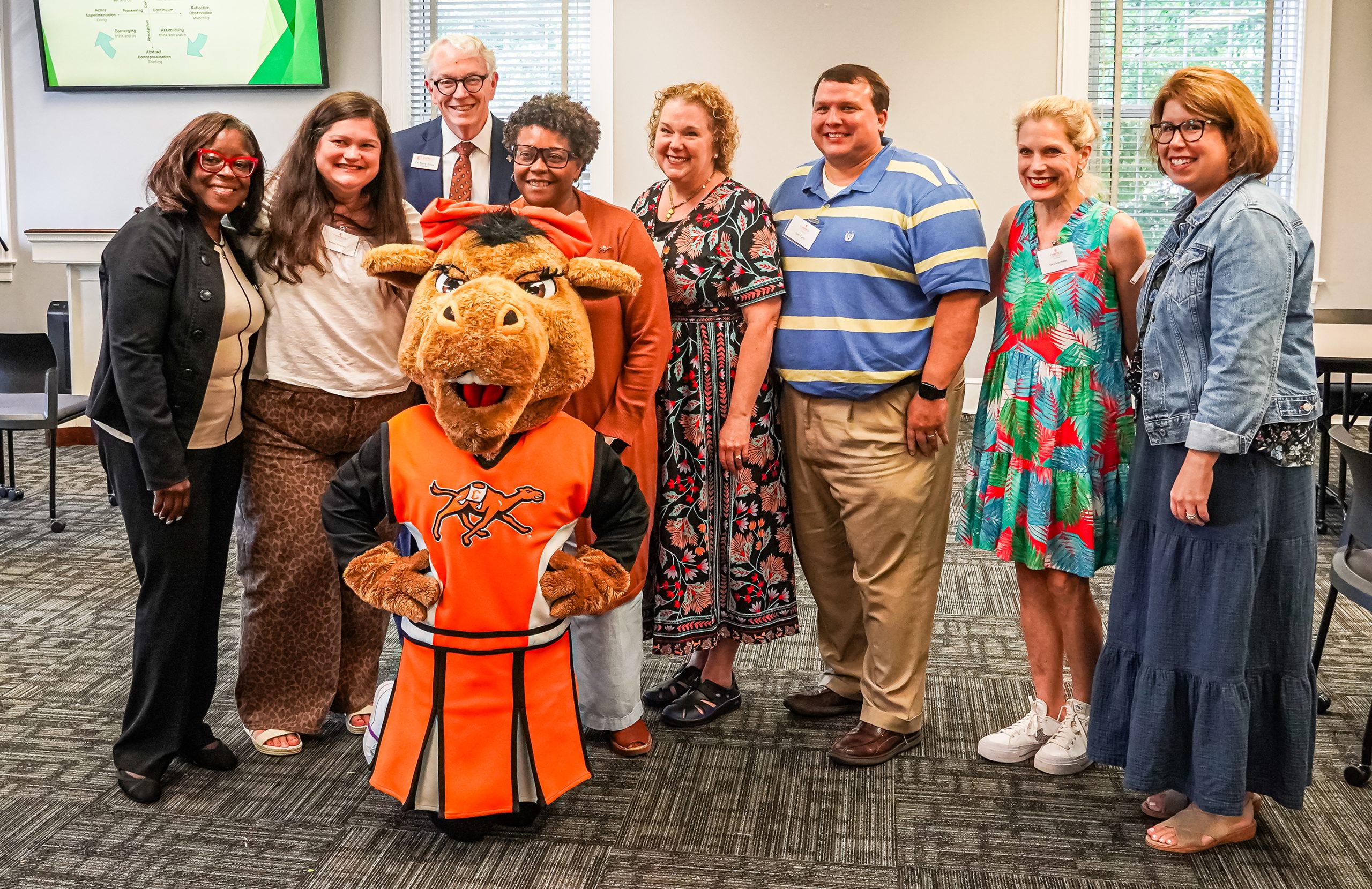 Jackson was surprised while on main campus Thursday — she is currently working toward a doctorate with the Divinity School — by President William Downs, classmates, Gladys the Camel and Law School Registrar Connie Shipman 