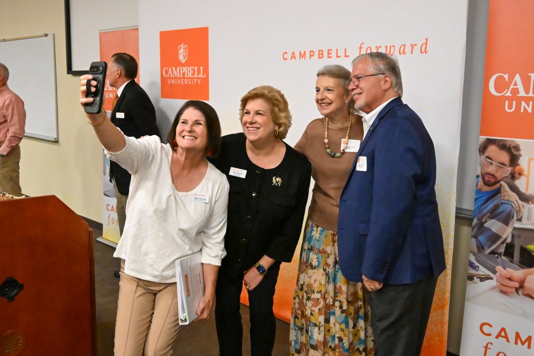 Photo of alumni gathering for a selfie