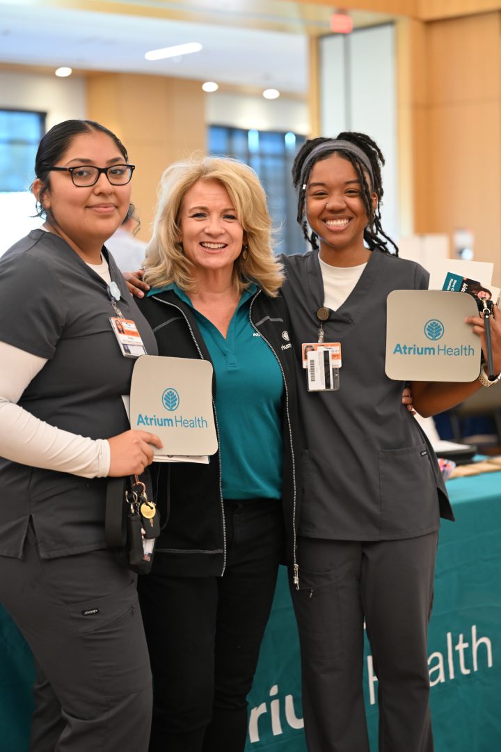 Nursing students posing with potential employer.