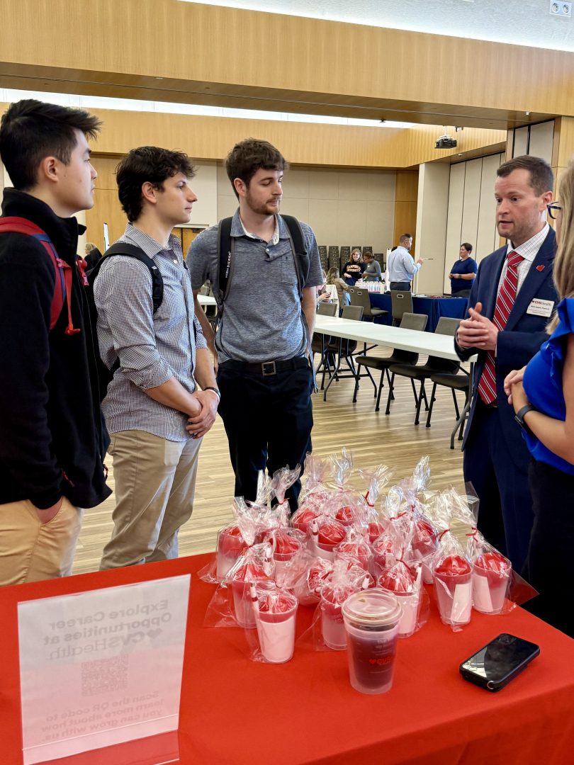 Preceptor talking with Pharmacy students.
