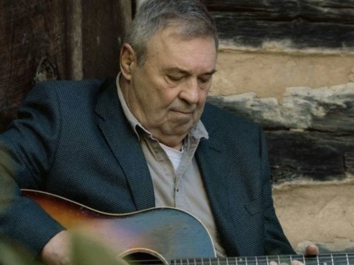 Photo of Campbell Law alumnus David Childers '81 playing his guitar