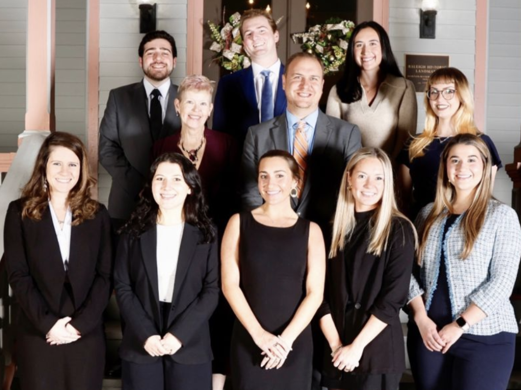 Photo of law students standing on steps of Gailor Family Law Litigation Clinic with Professor Richard Waugaman and Mary Accardi, office manager and paralegal