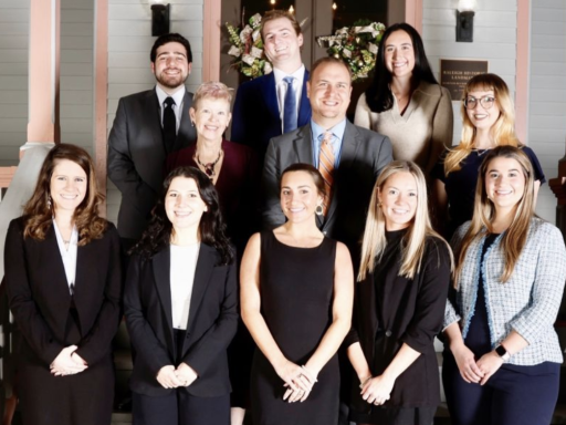 Photo of law students standing on steps of Gailor Family Law Litigation Clinic with Professor Richard Waugaman and Mary Accardi, office manager and paralegal