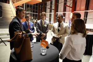 Photo of students talking to a prospective employer at Career Night 2025 in Raleigh Union Station