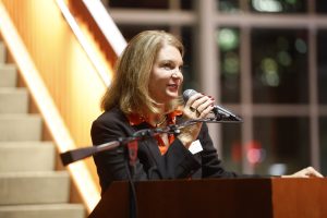 Photo of Campbell Law Assistant Dean Mallory Underwood speaking at podium at 2025 Career Night at Raleigh Union Station