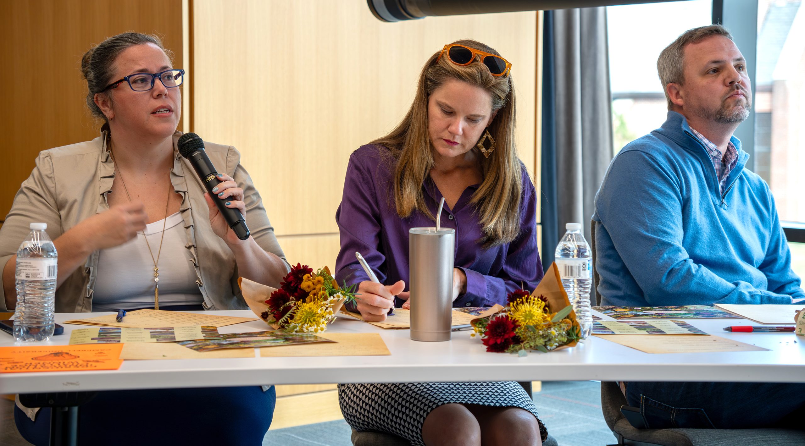 Speaker panel sitting at table