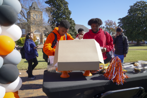 Campbell students grabbing snacks from table