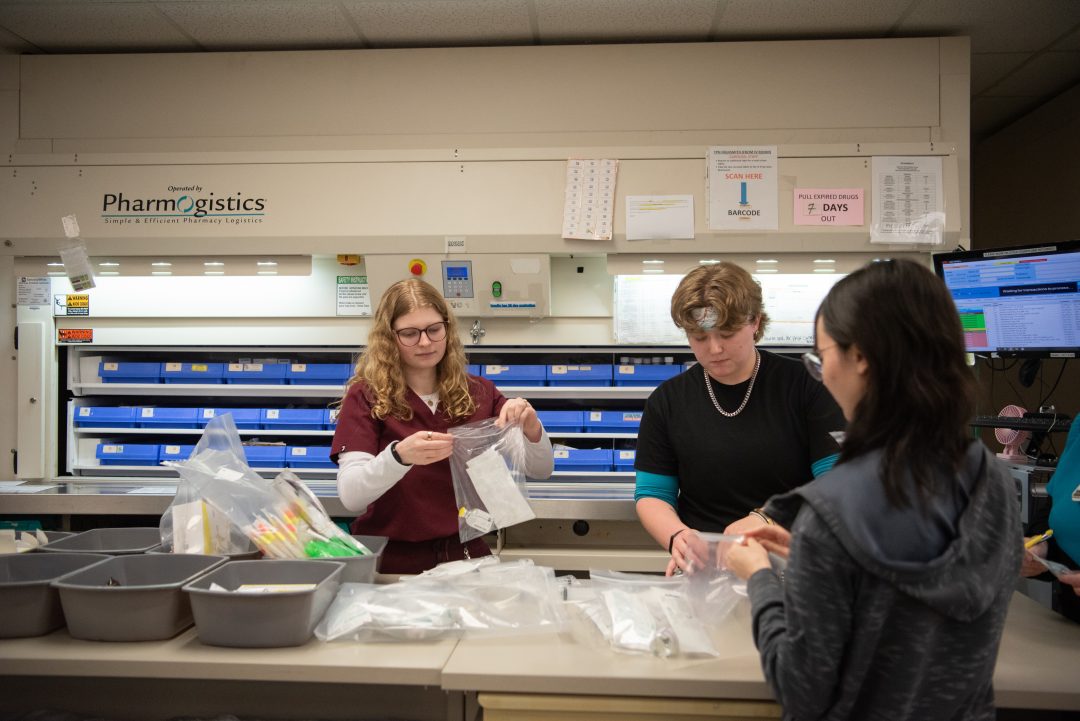 Pharmacy student working in hospital pharmacy.