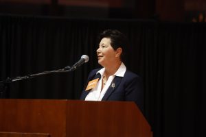 Shelby Benton '85 speaking at podium at 2025 Career Night at Raleigh Union Station
