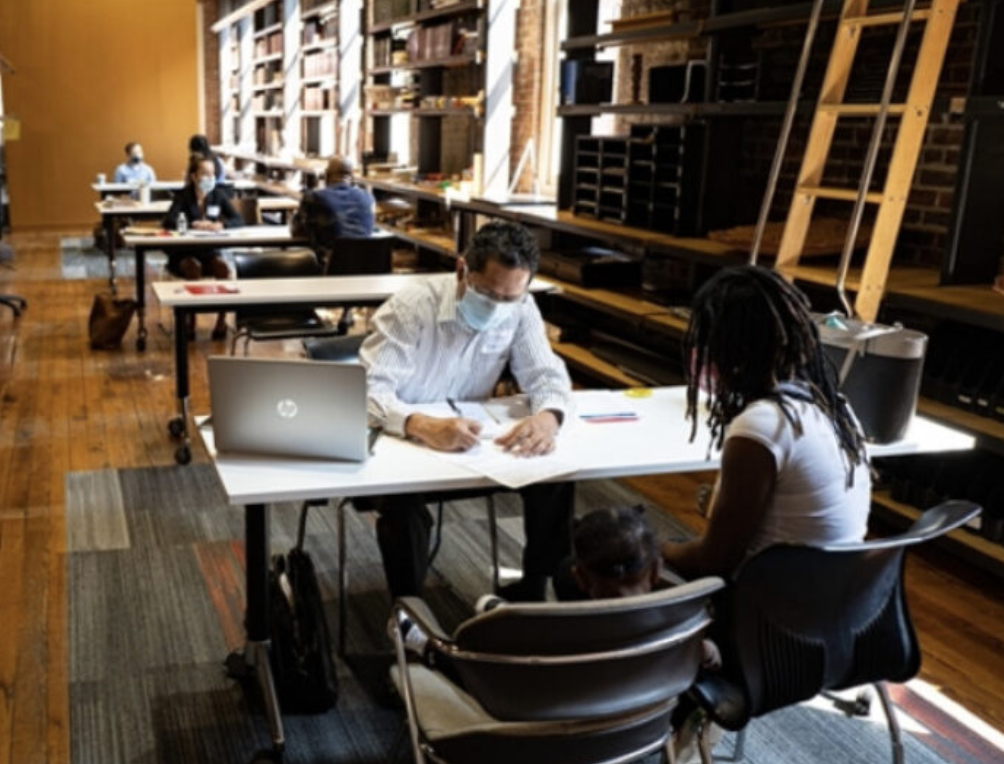 Photo of students working with clients in the Blanchard Community Law Clinic (BCLC)