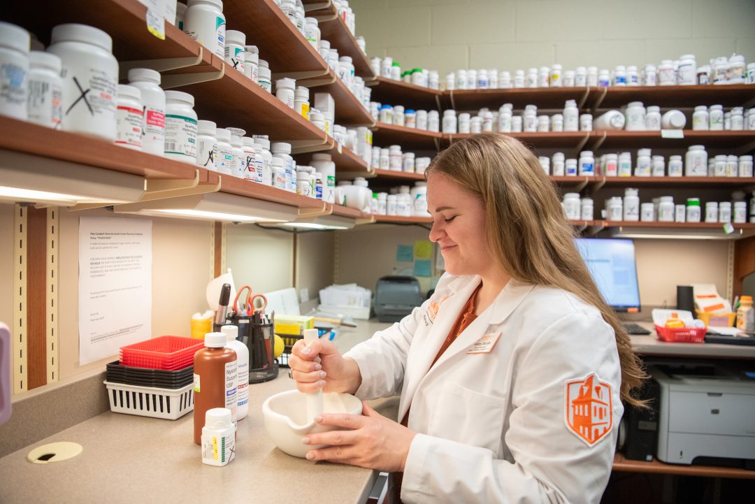 Student working in Health Center Pharmacy