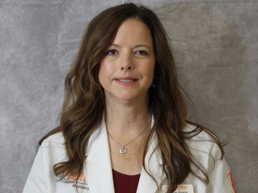 Susan Propst, PharmD Class of 2026 candidate, wearing her white coat