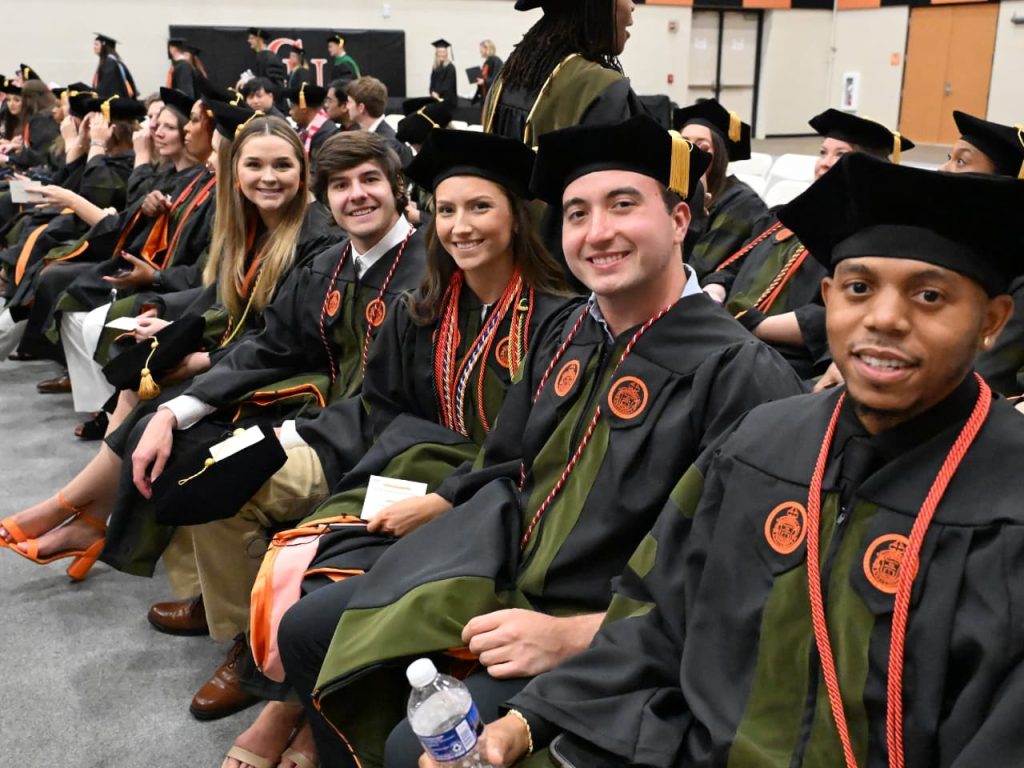 Pharmacy students waiting for graduation ceremony in May 2025