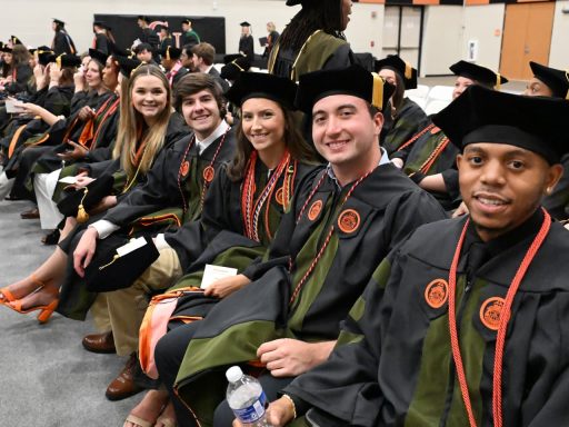 Pharmacy students waiting for graduation ceremony in May 2025