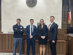 Photo of Team 2 with Coaches Professors Chris Cox and Charles Warren