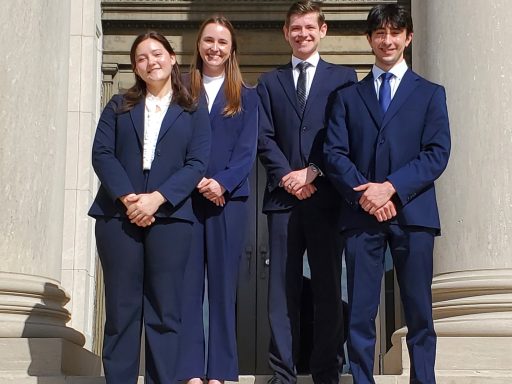 Photo of four Campbell Law advocates posing in front of courthouse in Baton Rouge at Bayou Challenge