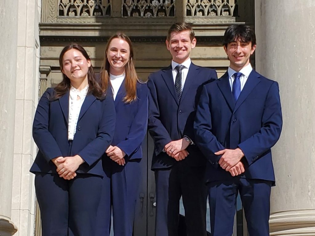 Photo of four Campbell Law advocates posing in front of courthouse in Baton Rouge at Bayou Challenge