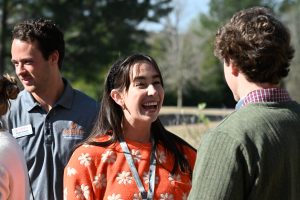 Incoming PA student laughs during an icebreaker game.
