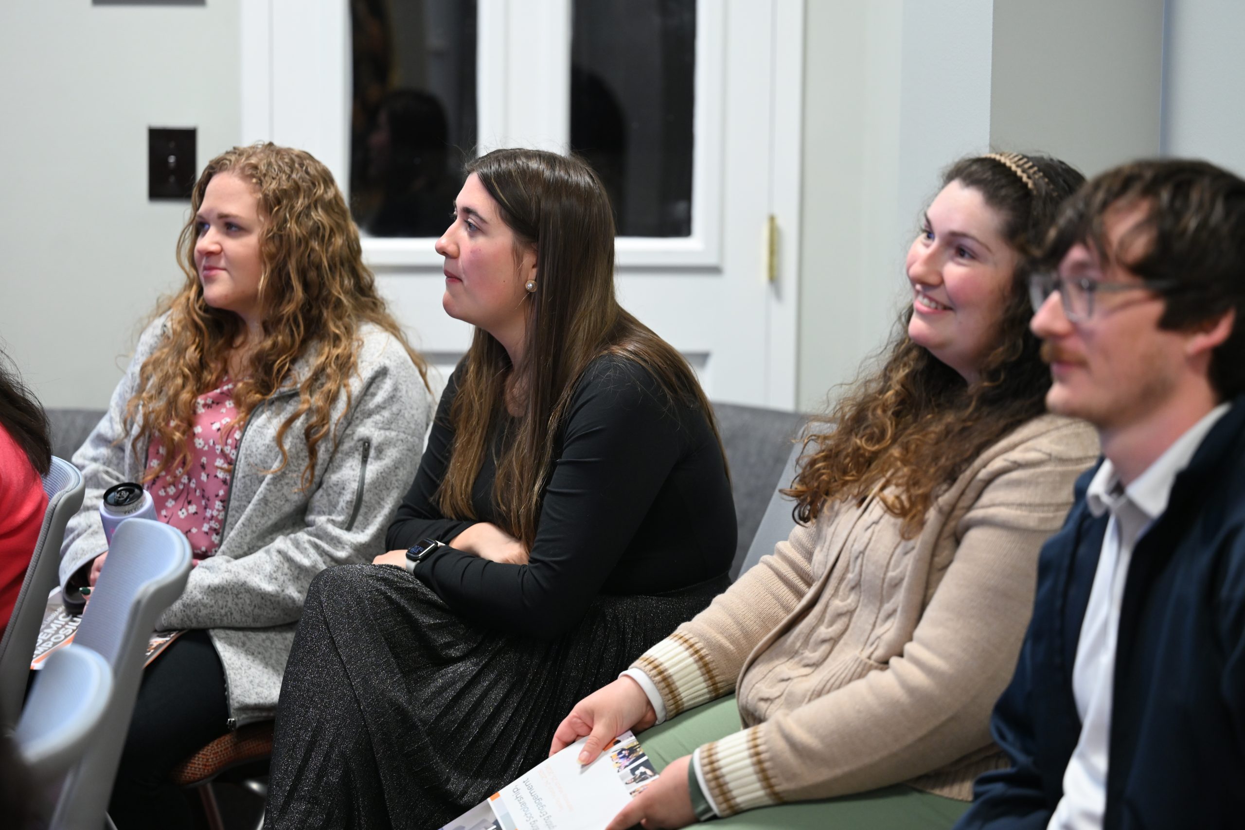 Group of students watching a presentation