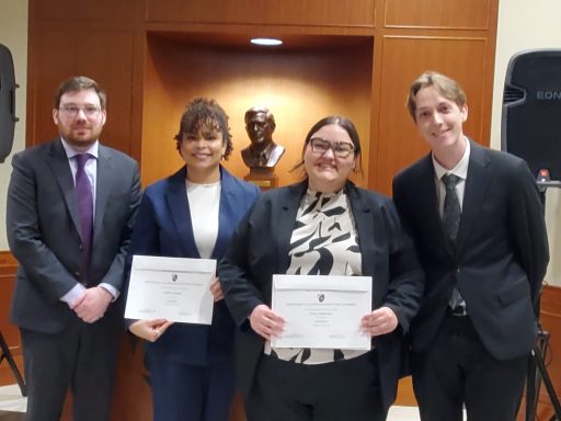 Photo of four people including Brittany Swanger and Grace Whittemore, 2026 Champions