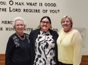 Photo of three people including Grace Whittemore and members of Rick Edmundson's family