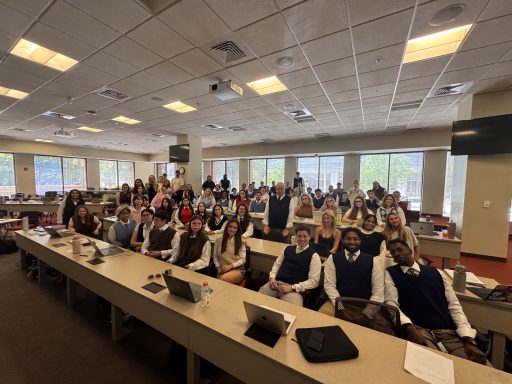 Photo of law students in sweater vests and mustaches with Professor Johnny Chriscoe '90 during his last class