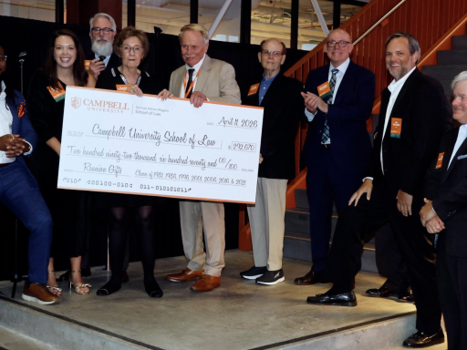 Photo of #CampbellLaw alumni reunion giving Dean Leonard a giant check for nearly $300,000