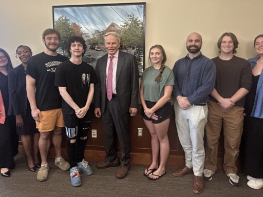 Photo of Campbell Law Dean Rich Leonard with eight students heading to Africa this summer to participate in inaugural judicial clerkship fellowship