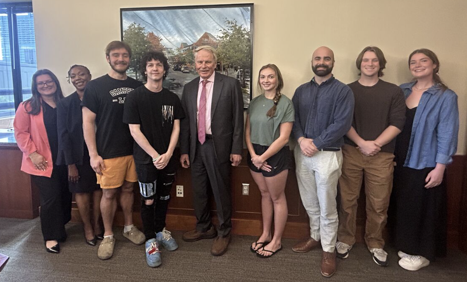Photo of Campbell Law Dean Rich Leonard with eight students heading to Africa this summer to participate in inaugural judicial clerkship fellowship