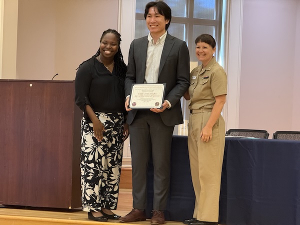 Photo of students during annual Navy research symposium.