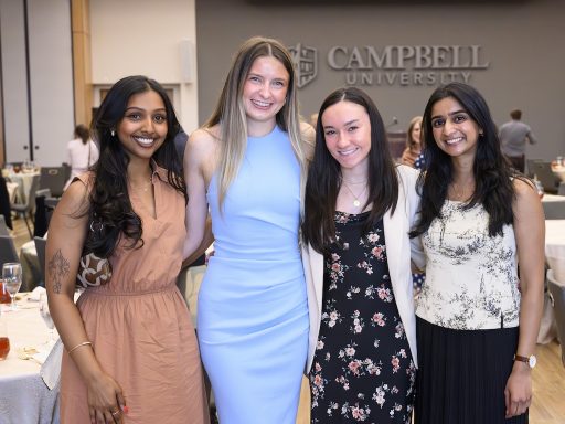 Students pose for a photo during the annual CUSOM awards dinner.