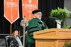 Dr. Robert A. Cain speaks to CUSOM graduates
